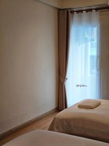 Get GuestHouse 2 ( Sangsri soi 4)客房内的一张或多张床位