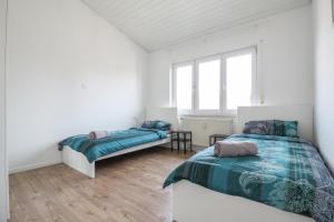 Кровать или кровати в номере nJoy! Sunny & Spacious - Balkon - WLAN - Parkplatz - perfekt für Work & Travel