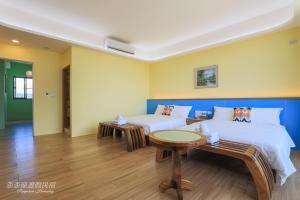 Postel nebo postele na pokoji v ubytování Pon Pon Wu Homestay