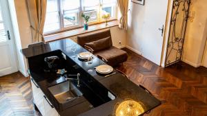 a kitchen with a sink and a counter top at Le Chouette Loft in Dijon