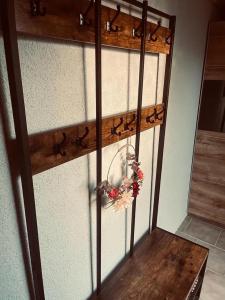 a room with a wooden shelf with a bird on it at Apartment Bella Petit in Rinderbügen