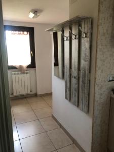 a bathroom with a window and a tile floor at APPARTAMENTO Tamburro in Campobasso +29 photos