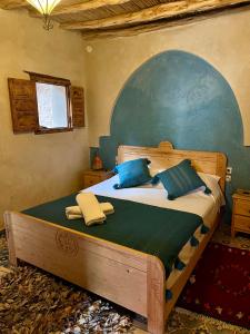 Tempat tidur dalam kamar di Les villas Nouran