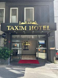 a hotel entrance with a sign that readstaxim hotel at TK Taxim Bosphorus Hotel in Istanbul