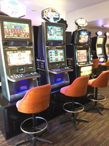 a bunch of slot machines in a casino at TRC Hotel in Launceston
