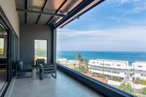 a balcony with a view of the ocean at FlamencoAccommodation in Ballito