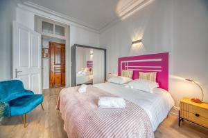Säng eller sängar i ett rum på La Belle Gare