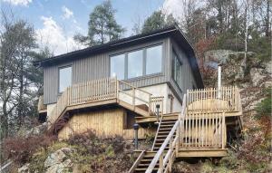 a house on top of a hill with stairs at 3 Bedroom Gorgeous Home In Ullared in Ullared