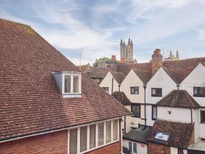 a view of roofs of houses with a cathedral at Host & Stay - Queen's Corner in Canterbury