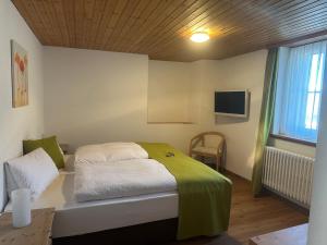 Postel nebo postele na pokoji v ubytování Wellnesshotel Liun