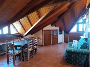 a living room with a table and a couch at Chiara Loft in Stresa
