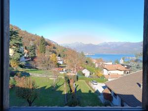 a view from a window of a town and a lake at Chiara Loft in Stresa