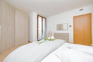 Postel nebo postele na pokoji v ubytování Milan Forum Camelia Guesthouse