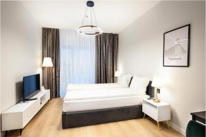 Aparthotel City Break Plac Wolności 6客房内的一张或多张床位