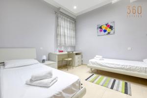 Un ou plusieurs lits dans un hébergement de l'établissement Charming 2BR home w/access to pool in Marsaskala by 360 Estates