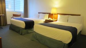 Postel nebo postele na pokoji v ubytování Hotel Bristol
