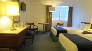 Postel nebo postele na pokoji v ubytování Hotel Bristol