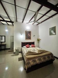 Postel nebo postele na pokoji v ubytování Sylvester Villa Hostel Negombo + 21 fotografií