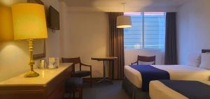 Postel nebo postele na pokoji v ubytování Hotel Bristol