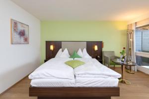 Letto o letti in una camera di See & Wellnesshotel Gerbi