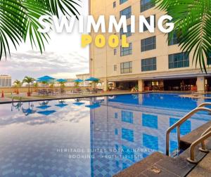 a magazine cover of a swimming pool in front of a hotel at Studio Exclusive Swimming pool view by HERITAGE SUITES Near IMAGO Mall City Central , FREE HIGHSPEED WIFI & NETFLIX , KOTA KINABALU in Kota Kinabalu
