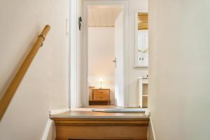 a hallway with a stairway leading into a room at Nice Days in Bad Harzburg +19 photos