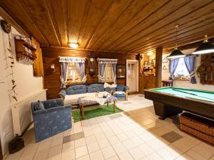 a living room with a pool table in it at Roubenka Bruno in Karlovy Vary