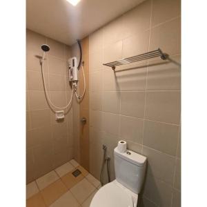 a bathroom with a toilet and a shower at Sakura Elite Kuala Lumpur in Kuala Lumpur