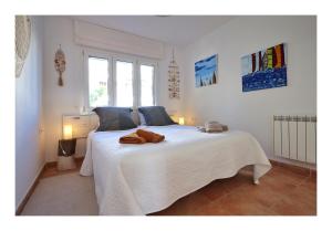 Ένα ή περισσότερα κρεβάτια σε δωμάτιο στο Appartement vue Mer à 300m de la plage - Son Parc +38 φωτογραφίες