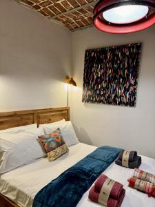 a bedroom with two beds and a painting on the wall at Heristage Istanbul Galataport in Istanbul
