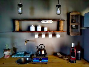 a kitchen counter with a tea kettle on a stove at Duiker's self catering Accommodation in Askham