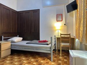 Postel nebo postele na pokoji v ubytování Kecskeméti Rooms