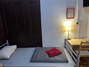 Postel nebo postele na pokoji v ubytování Kecskeméti Rooms