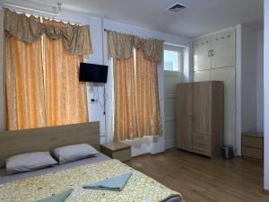 Postel nebo postele na pokoji v ubytování Kecskeméti Rooms
