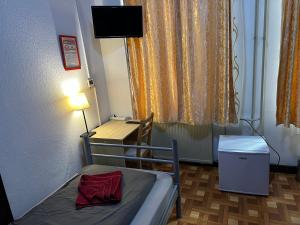 TV a/nebo společenská místnost v ubytování Kecskeméti Rooms