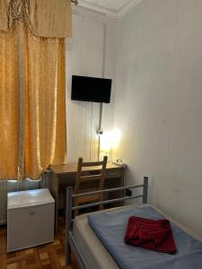 Postel nebo postele na pokoji v ubytování Kecskeméti Rooms