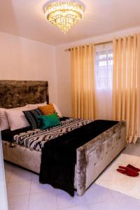 Postel nebo postele na pokoji v ubytování Juston Homes AirBNB kisii