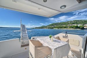 a table on the back of a boat on the water at Luxury Yacht - Lex of the Seas in Split