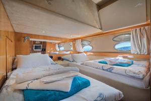a room with two beds in the back of a boat at Luxury Yacht - Lex of the Seas in Split