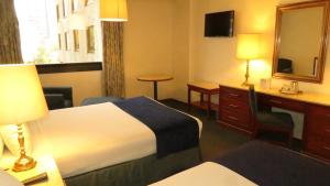 Postel nebo postele na pokoji v ubytování Hotel Bristol