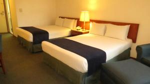 Postel nebo postele na pokoji v ubytování Hotel Bristol