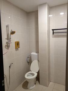 a bathroom with a toilet and a shower at Hotel Seri Intan Tampin in Tampin