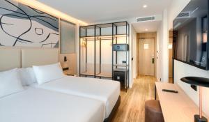 Camera con letto e TV di Sercotel Rosaleda Málaga a Málaga