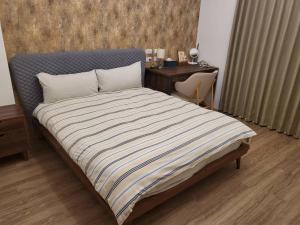 Letto o letti in una camera di 9 Tan Yuan Homestay
