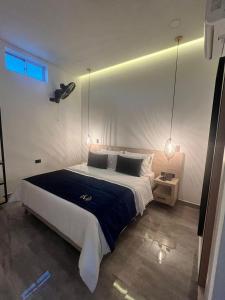 Postel nebo postele na pokoji v ubytování HOTEL MASS LUXURY