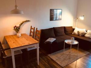 a living room with a couch and a table at Peenekoje in Peenemünde