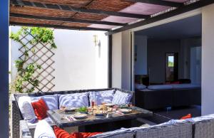 a living room with a couch and a table at Villa Mare in Corbara