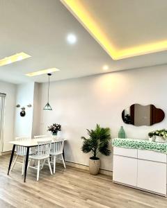 a dining room with a table and chairs at Muong Thanh Son Tra Apartment Seaview Da Nang in Da Nang