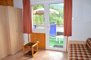 Postel nebo postele na pokoji v ubytování Appartamenti Vacanze Casa Marilleva