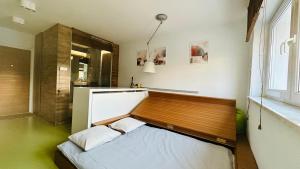 Ένα ή περισσότερα κρεβάτια σε δωμάτιο στο Smart Apartment Warsaw